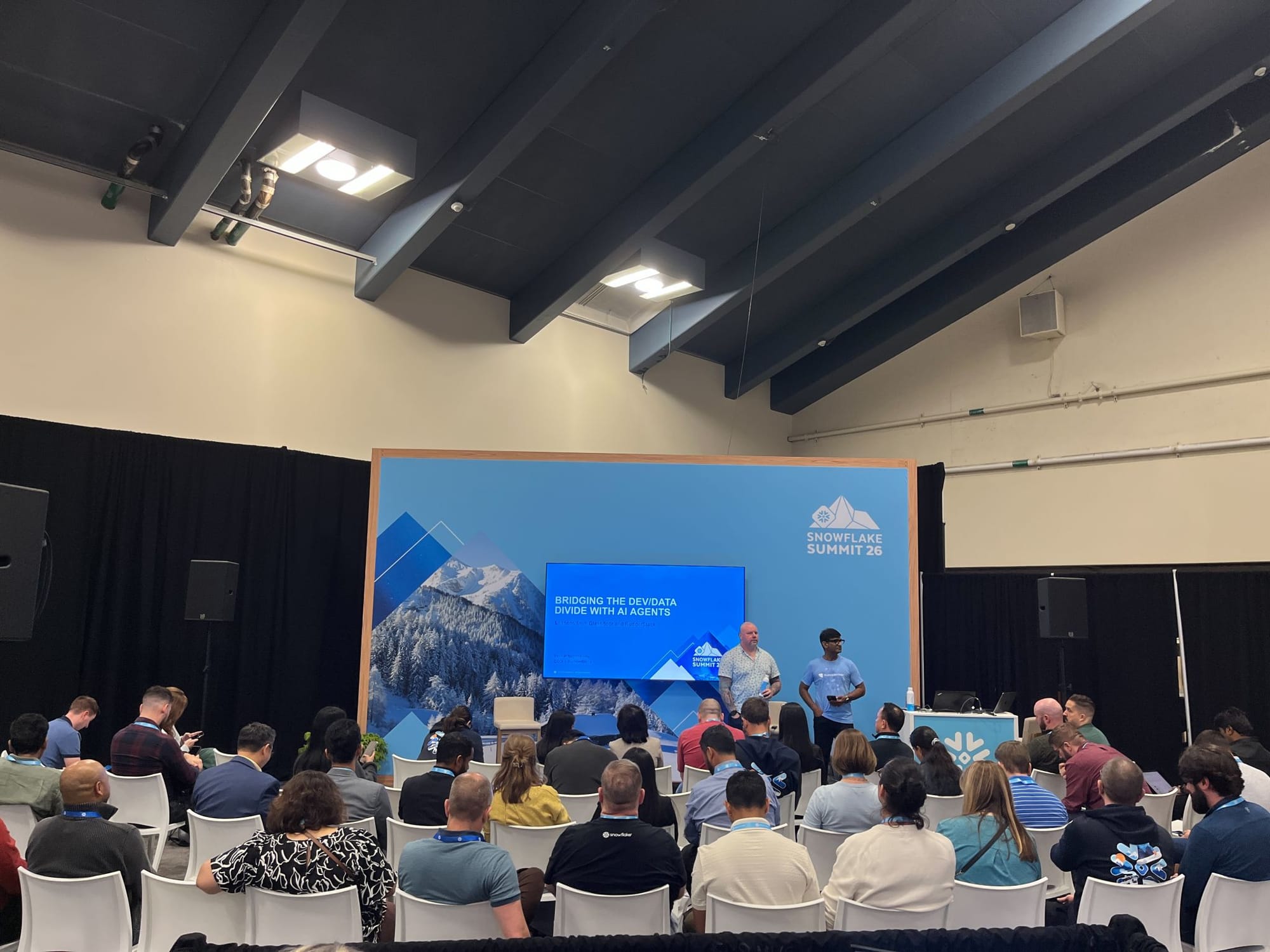 RudderStack session at Snowflake Summit 26 titled Bridging the dev data divide with AI agents